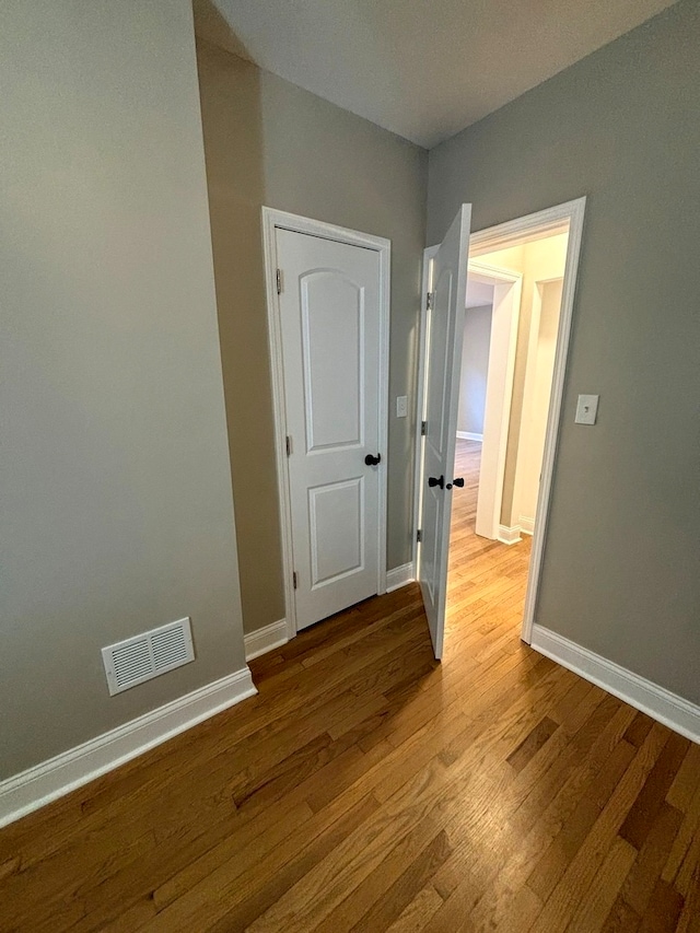 hall with light hardwood / wood-style flooring