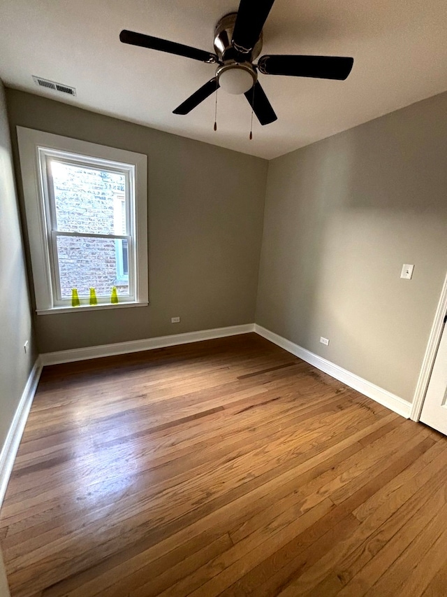 empty room with light hardwood / wood-style floors and ceiling fan