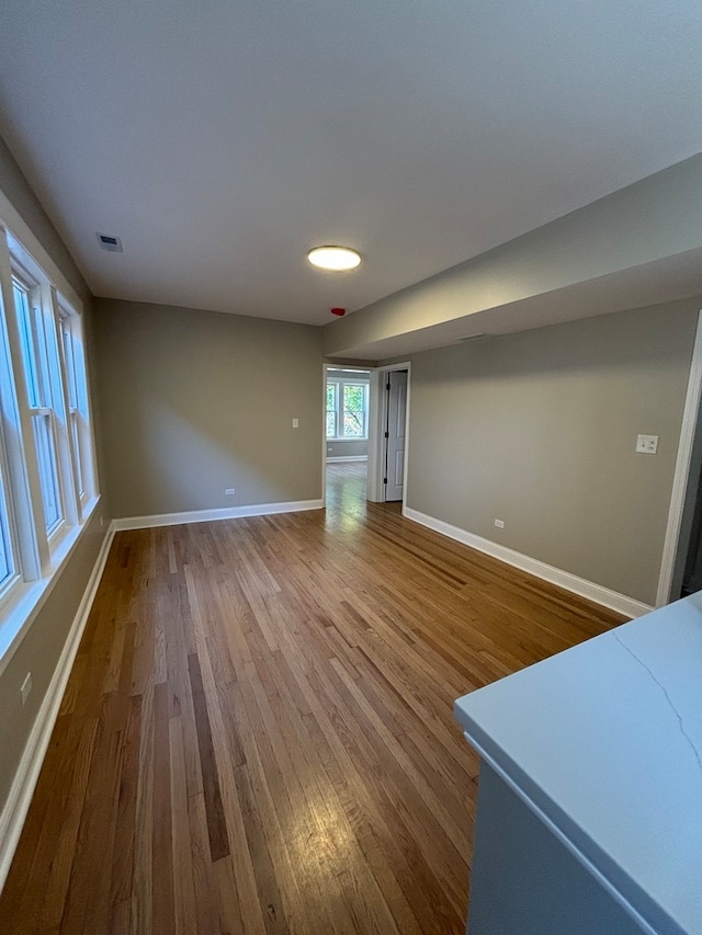 unfurnished living room with wood-type flooring