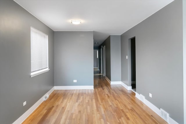 spare room featuring light wood-type flooring