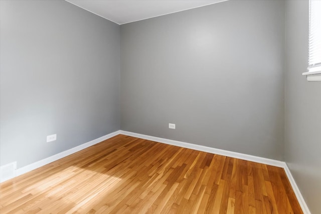 spare room featuring hardwood / wood-style flooring