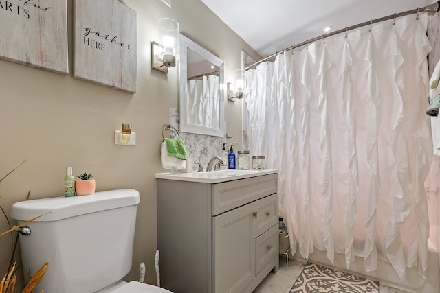 full bathroom featuring vanity, toilet, and shower / bathtub combination with curtain