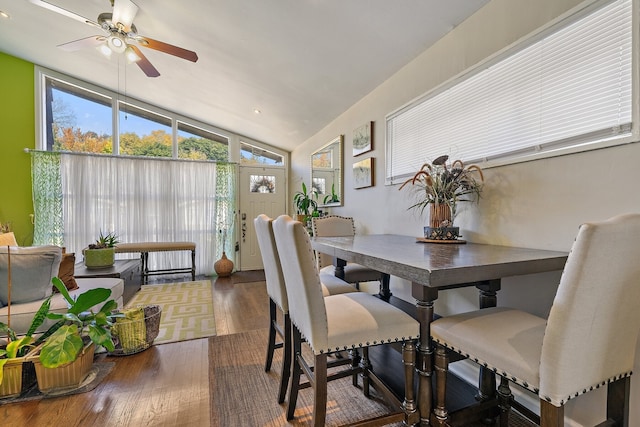 dining space featuring lofted ceiling, hardwood / wood-style floors, and ceiling fan