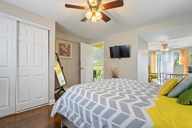 bedroom with dark hardwood / wood-style flooring, a closet, and ceiling fan