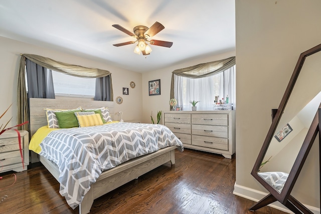 bedroom featuring ceiling fan and dark hardwood / wood-style flooring