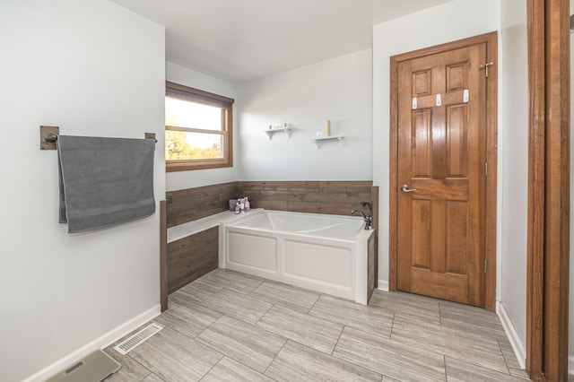 bathroom featuring a tub