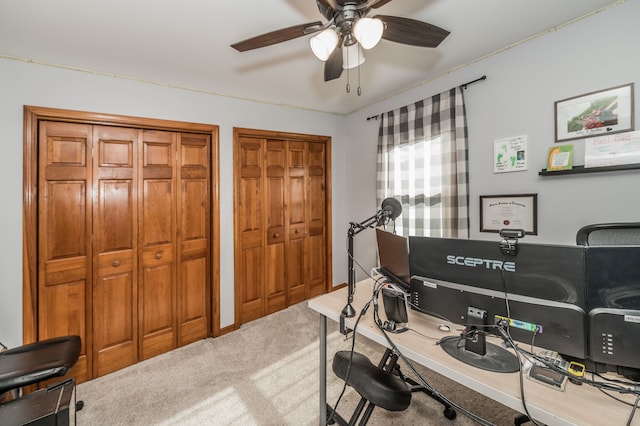 home office with ceiling fan and carpet flooring