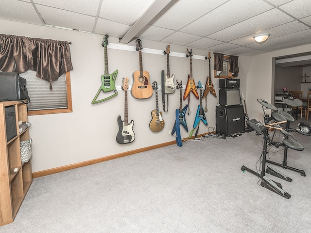 exercise area with carpet and a drop ceiling