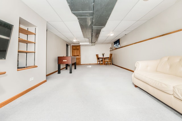 interior space with carpet and a paneled ceiling