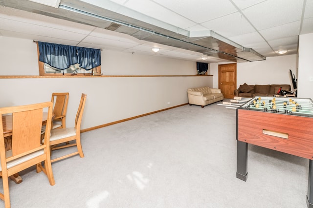 recreation room with carpet flooring and a paneled ceiling