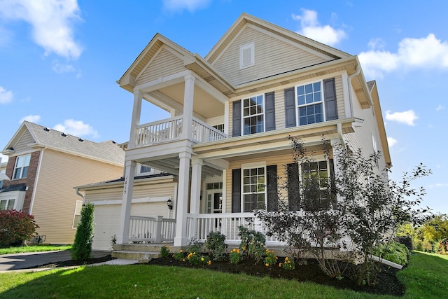 view of front of home featuring a garage and a front lawn