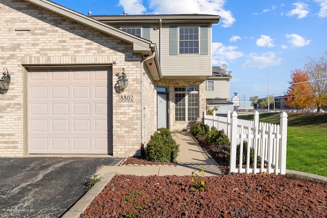 doorway to property featuring a garage