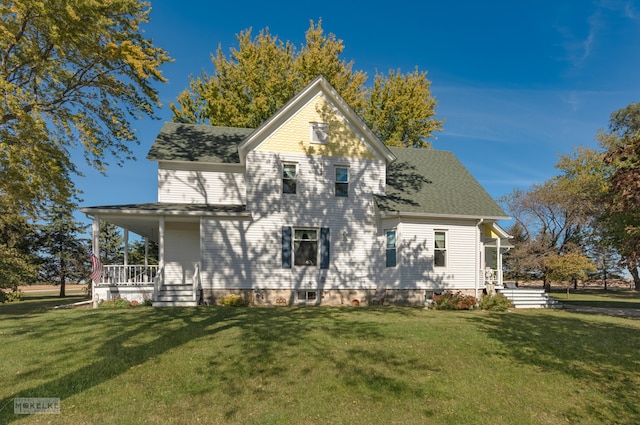 back of house with a porch and a lawn