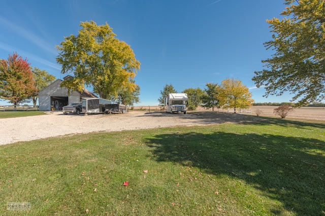 view of yard with a rural view