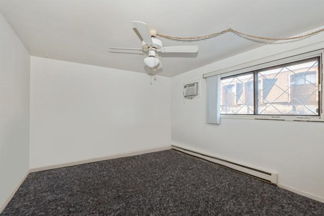 full bathroom featuring vanity, enclosed tub / shower combo, toilet, and tile patterned floors