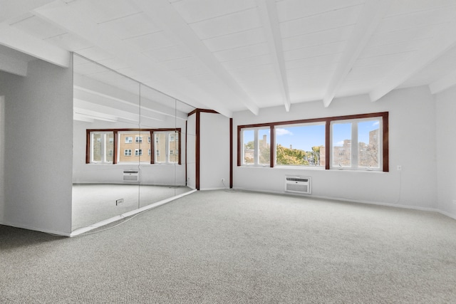 carpeted empty room featuring vaulted ceiling with beams and a wall mounted AC