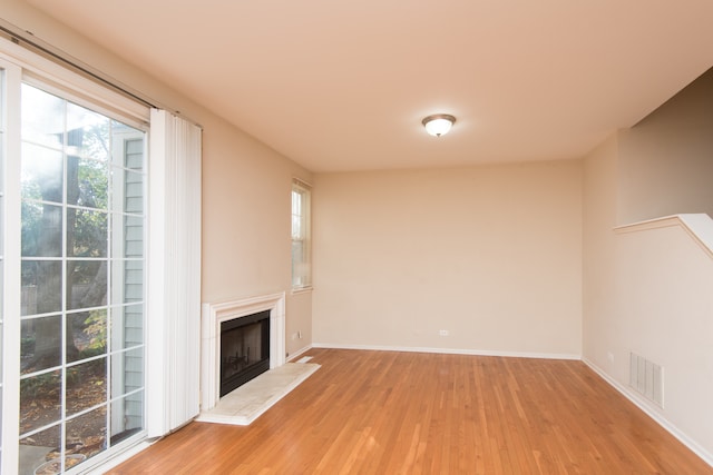 unfurnished living room featuring light hardwood / wood-style flooring