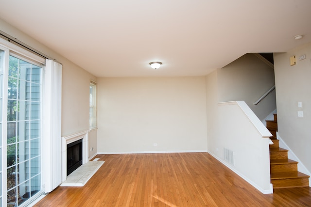 unfurnished living room featuring hardwood / wood-style floors