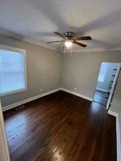 spare room with ornamental molding, dark hardwood / wood-style floors, and ceiling fan