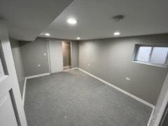 basement featuring carpet flooring