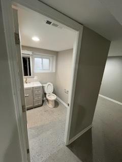 bathroom with vanity and toilet