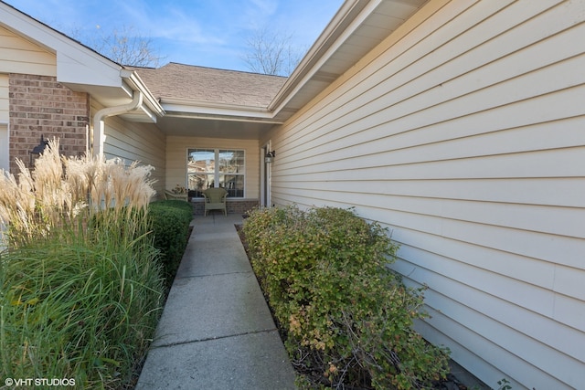 doorway to property with a patio area