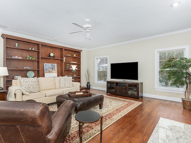 living room with dark hardwood / wood-style flooring, crown molding, and ceiling fan