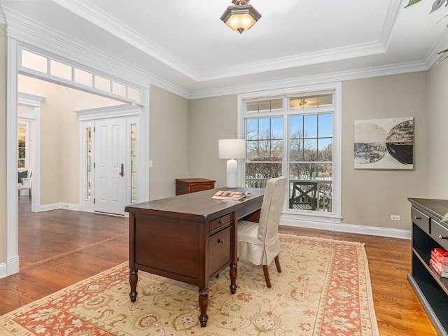 home office with hardwood / wood-style flooring and crown molding