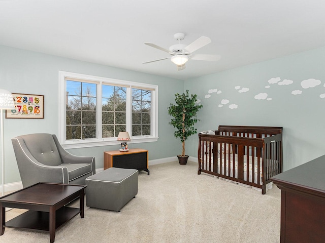 bedroom with light colored carpet and ceiling fan