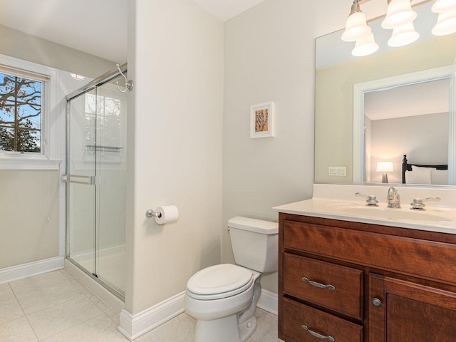 bathroom featuring tile patterned flooring, vanity, toilet, and a shower with shower door