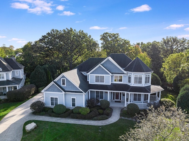 view of front of house featuring a front yard and covered porch