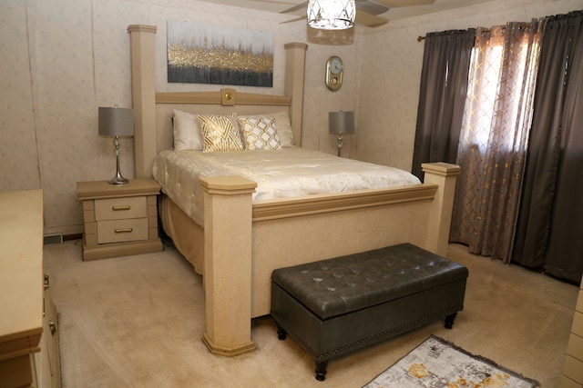 bedroom featuring ceiling fan and light colored carpet