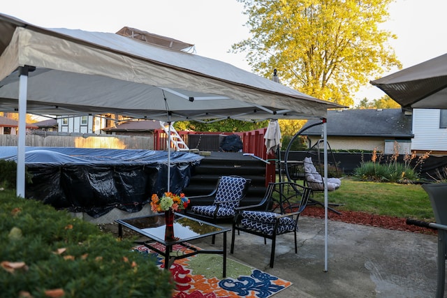 view of patio featuring a gazebo and a covered pool