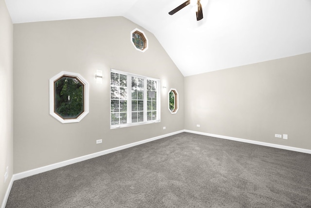 empty room featuring dark carpet, lofted ceiling, and ceiling fan