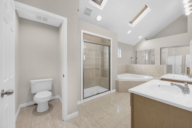 full bathroom featuring toilet, vaulted ceiling with skylight, independent shower and bath, and vanity