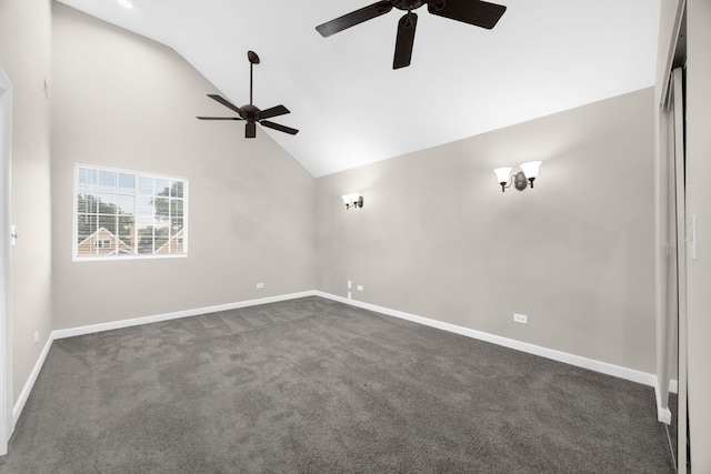 empty room featuring ceiling fan, high vaulted ceiling, and dark colored carpet