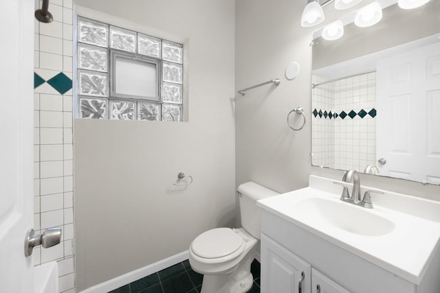 bathroom with vanity, toilet, and tile patterned flooring