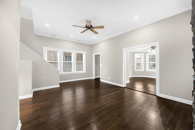 unfurnished living room with crown molding, dark hardwood / wood-style floors, and ceiling fan