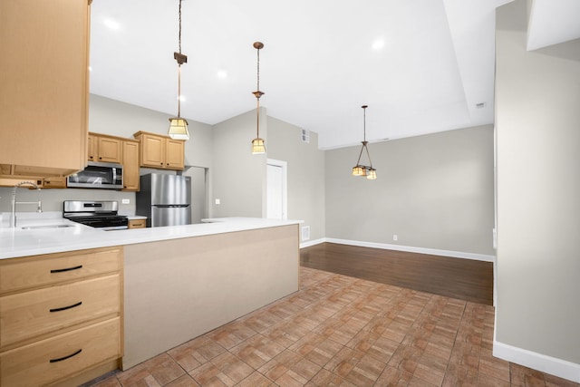 kitchen with light brown cabinets, appliances with stainless steel finishes, sink, light hardwood / wood-style floors, and decorative light fixtures