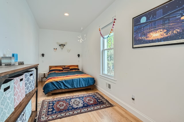 bedroom with wood-type flooring