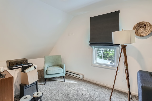 interior space with lofted ceiling, carpet, and a baseboard heating unit