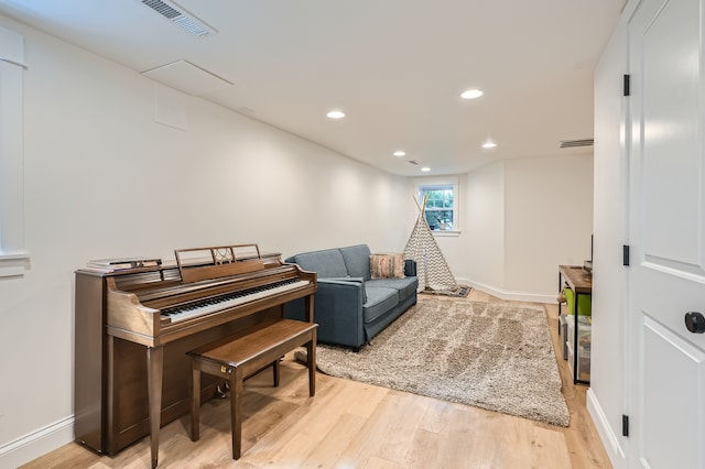 living area with light hardwood / wood-style floors