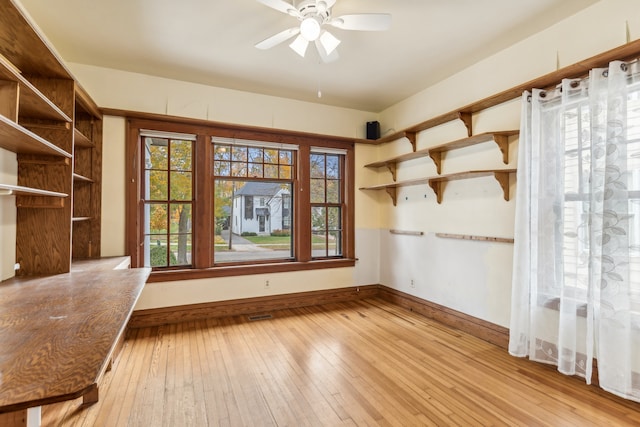 empty room featuring light hardwood / wood-style flooring and ceiling fan