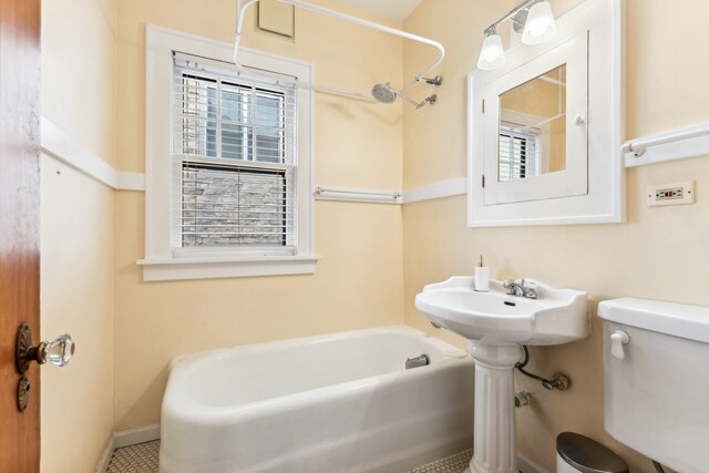 full bathroom with sink, shower / bathing tub combination, toilet, and tile patterned flooring