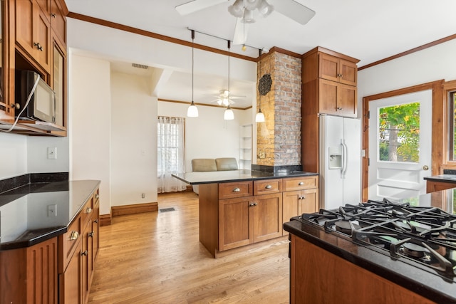 kitchen with crown molding, light hardwood / wood-style floors, white fridge with ice dispenser, and plenty of natural light