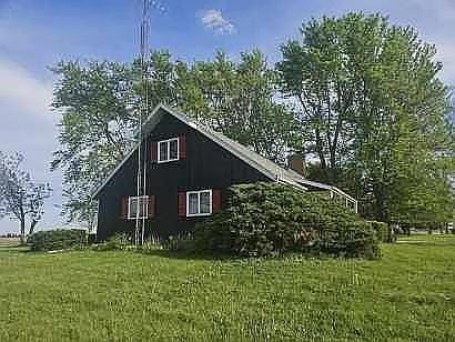 view of side of home featuring a yard