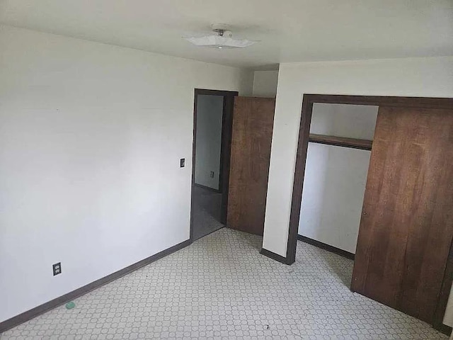 unfurnished bedroom with a closet