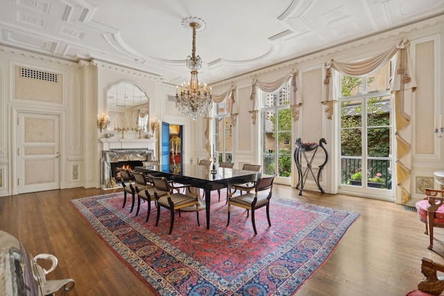 1355 N Astor St, Chicago, IL 60610 - dining space featuring a decorative wall, ornamental molding, visible vents, a premium fireplace, and a notable chandelier