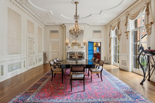 1355 N Astor St, Chicago, IL 60610 - dining room with a chandelier, visible vents, and wood finished floors