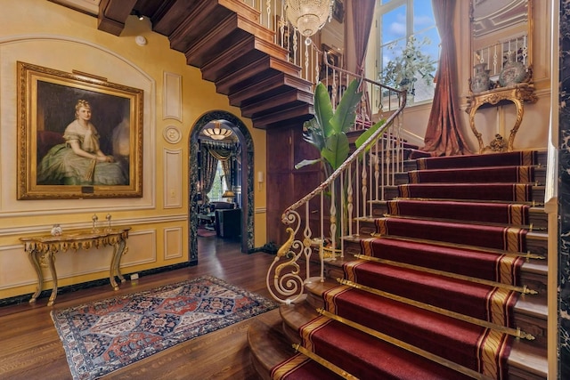 1355 N Astor St, Chicago, IL 60610 - stairway with arched walkways, a healthy amount of sunlight, and wood finished floors